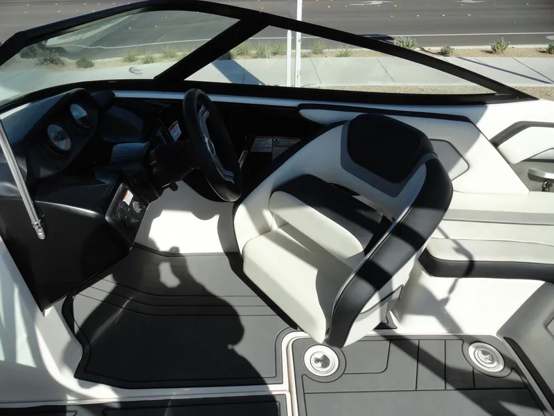 Slide: The Image of 2017 Yamaha AR195 boat interior with steering wheel and seating. - 12