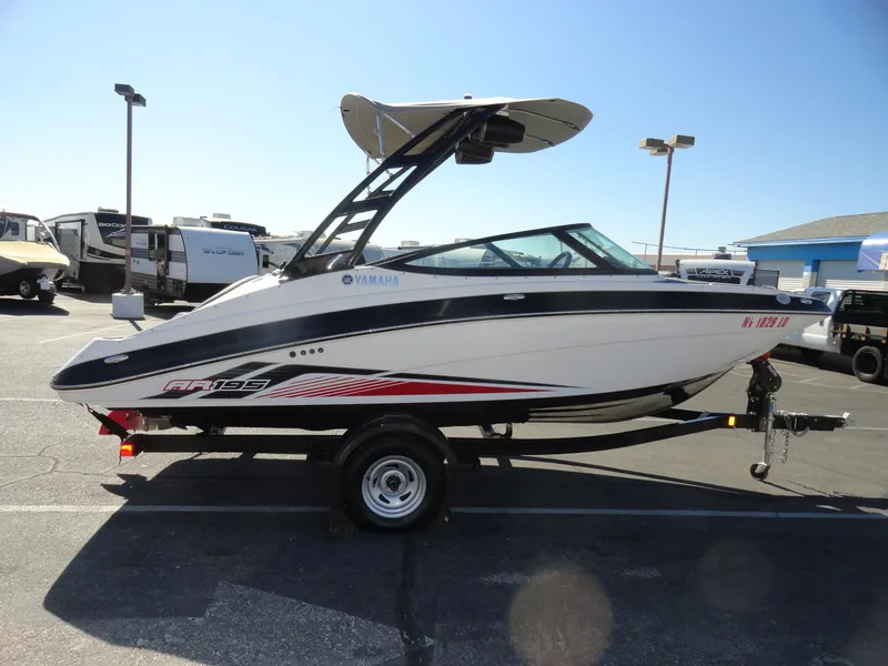 Slide: The Image of 2017 Yamaha AR195 boat on trailer in parking lot, side view. - 5