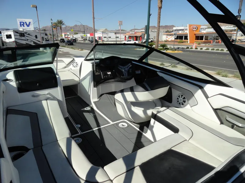 Slide: The Image of 2017 Yamaha AR195 boat interior with sleek seating and modern dashboard. - 7