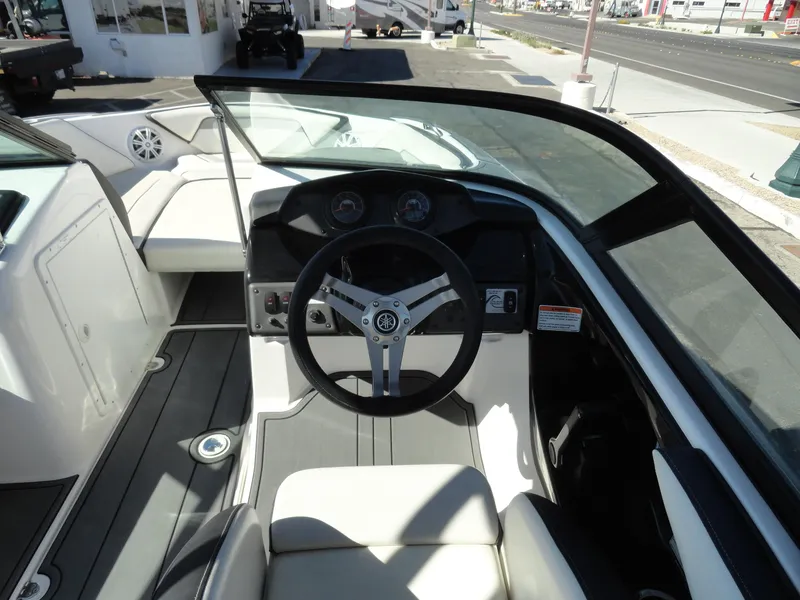 Slide: The Image of 2017 Yamaha Boats AR195 cockpit with steering wheel and dashboard controls. - 8