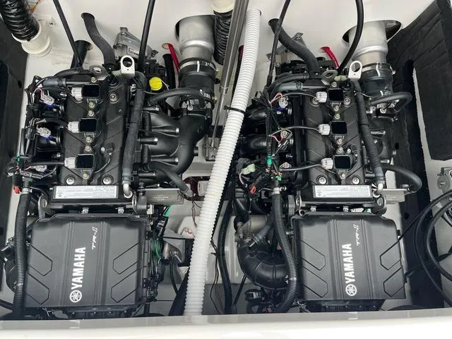 Slide: The Image of 2025 Yamaha Boats AR220 engine compartment with dual Yamaha engines. - 10