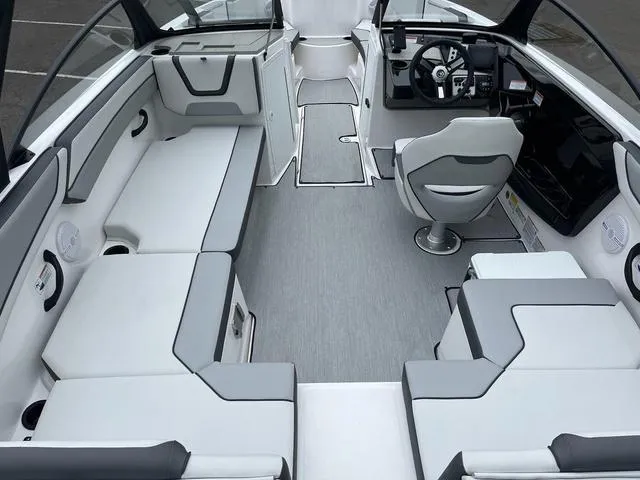 Slide: The Image of Interior of 2025 Yamaha Boats AR220, featuring sleek seating and modern dashboard design. - 7