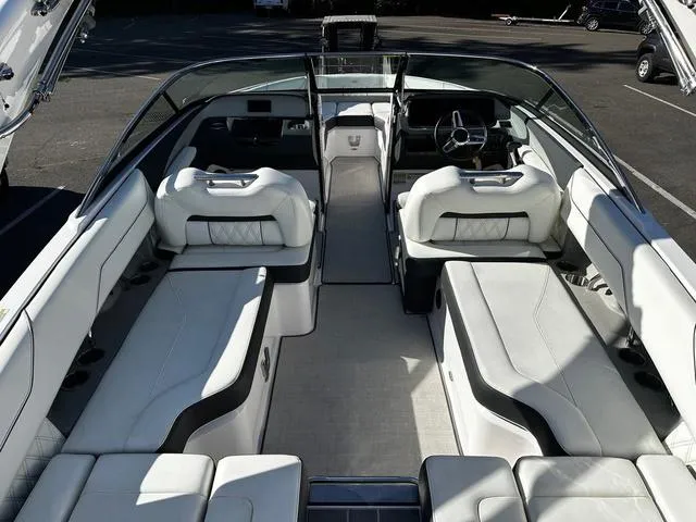 Slide: The Image of 2021 Regal LS4 boat interior with luxurious white seating and sleek design. - 10