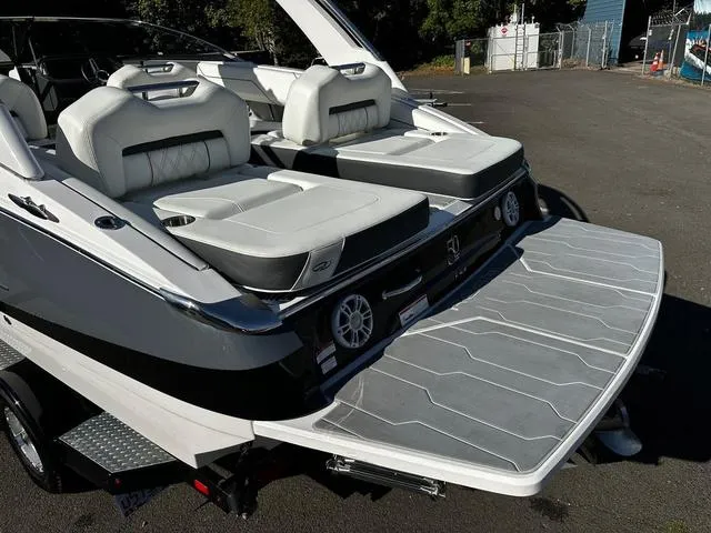 Slide: The Image of 2021 Regal LS4 boat with spacious seating and swim platform. - 11