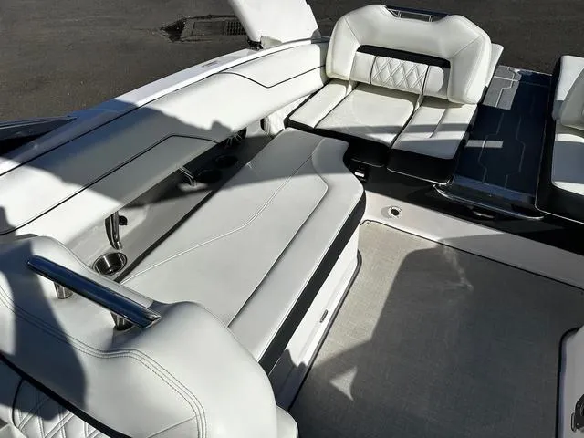 Slide: The Image of 2021 Regal LS4 boat interior with white leather seating and modern design. - 4