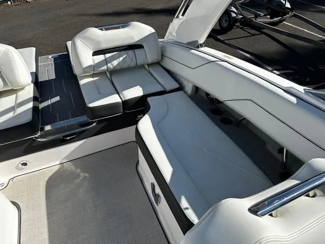 Slide: The Image of 2021 Regal LS4 boat interior with white leather seating and sleek design. - 5