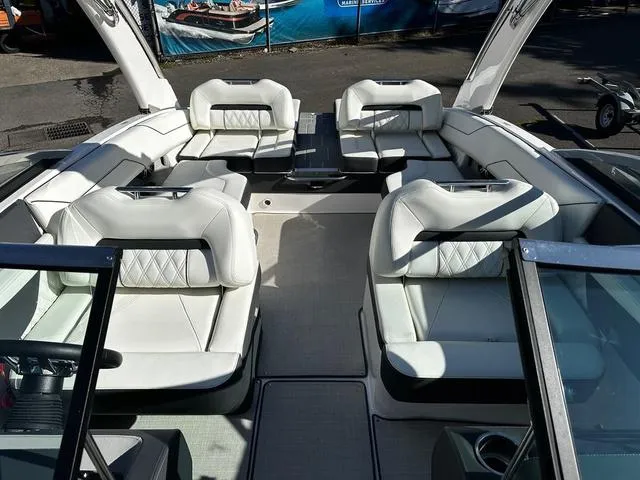 Slide: The Image of 2021 Regal LS4 boat interior with luxurious white seating and modern design. - 6