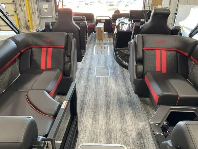 Slide: The Image of Interior of 2025 Bennington 24 MFB pontoon boat with luxurious seating and modern design. - 11