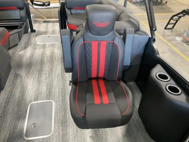 Slide: The Image of 2025 Bennington 24 MFB boat interior with stylish black and red seating. - 18