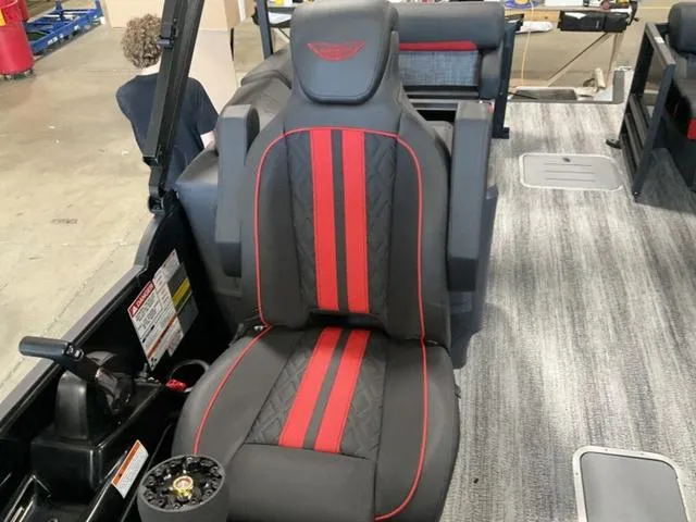 Slide: The Image of 2025 Bennington 24 MFB boat interior with stylish black and red seating. - 19