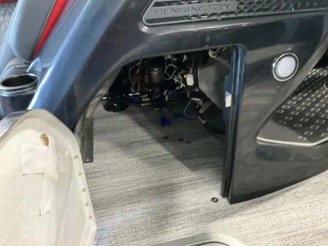 Slide: The Image of Bennington 24 MFB 2025 boat interior with open storage compartment. - 23