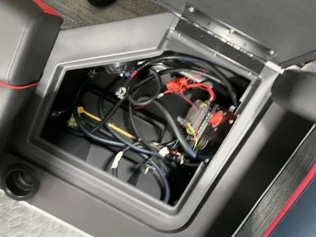 Slide: The Image of Battery compartment of 2025 Bennington 24 MFB boat with wiring and cables. - 25
