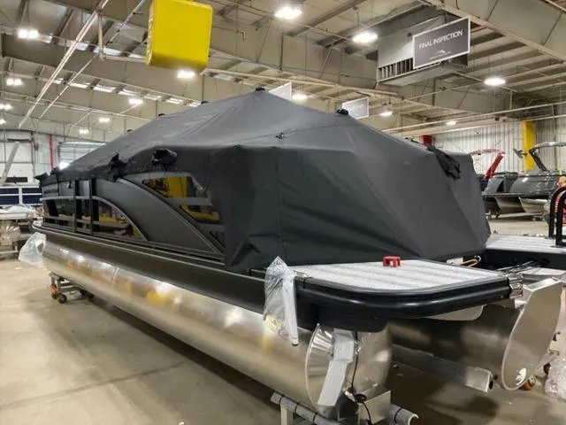 Slide: The Image of 2025 Bennington 24 MFB pontoon boat covered in a warehouse setting. - 26