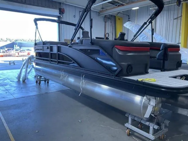 Slide: The Image of 2025 Bennington 24 MFB pontoon boat in a warehouse setting. - 30