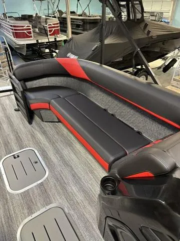 Slide: The Image of 2025 Bennington 24 MFB boat interior with sleek black and red seating. - 31