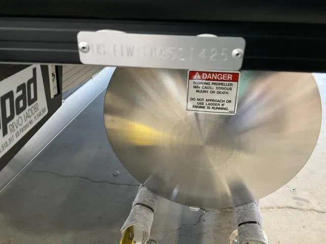 Slide: The Image of Bennington 24 MFB 2025 boat propeller with safety warning label. - 7