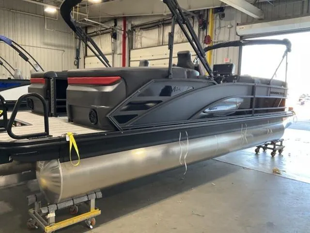 Slide: The Image of 2025 Bennington 24 MFB pontoon boat in a warehouse setting. - 8