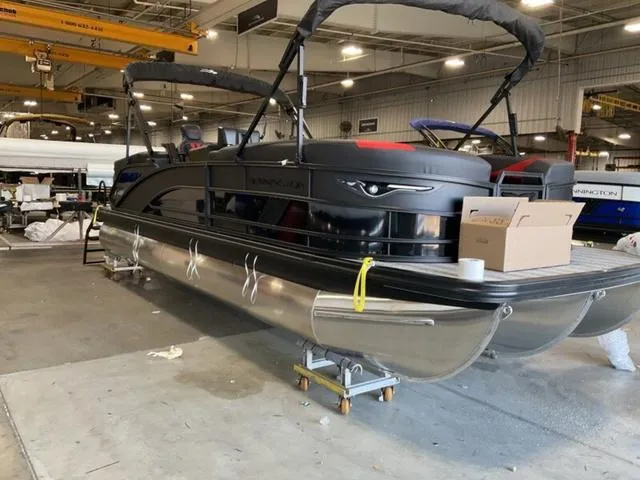 Slide: The Image of 2025 Bennington 24 MFB pontoon boat in a warehouse setting. - 9