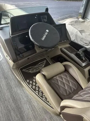 Slide: The Image of 2025 Bennington 25 QSBA boat interior with steering wheel and luxurious seating. - 3