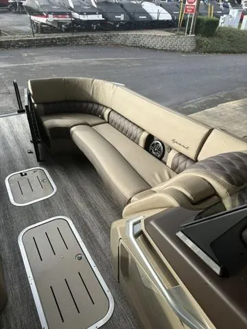 Slide: The Image of 2025 Bennington 25 QSBA boat interior with beige seating and modern design. - 4
