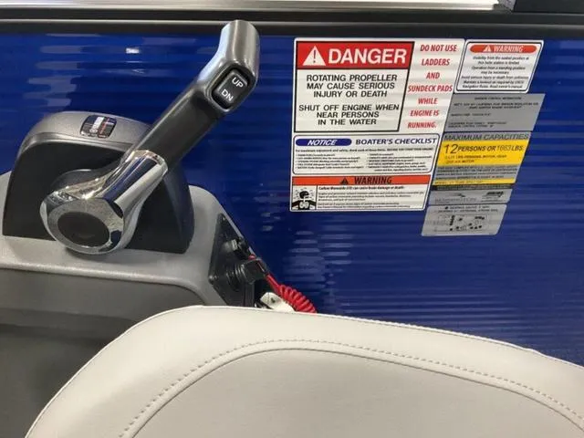 Slide: The Image of Storage compartment of 2025 Bennington 22SSB-SPS boat, featuring carpeted interior. - 16