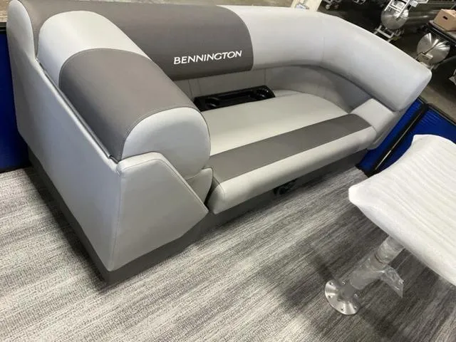 Slide: The Image of 2025 Bennington 22SSB-SPS pontoon boat interior with gray seating and carpet flooring. - 20