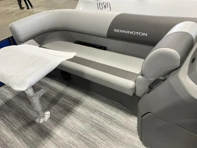 Slide: The Image of 2025 Bennington 22SSB-SPS pontoon boat interior with gray seating and modern design. - 21