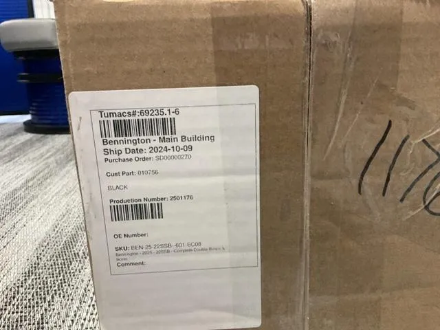 Slide: The Image of Storage compartment in a 2025 Bennington 22SSB-SPS boat, containing packaged items. - 24