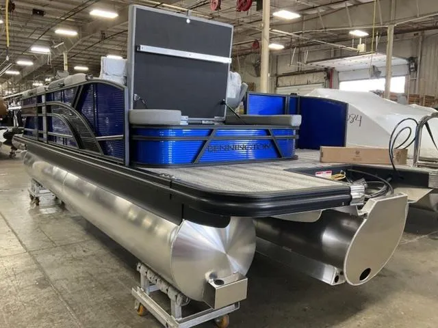 Slide: The Image of Storage compartment of 2025 Bennington 22SSB-SPS with cables and a cardboard box. - 8