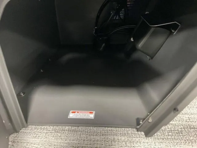 Slide: The Image of Interior compartment of 2025 Bennington 22 SSR boat, featuring storage space. - 14