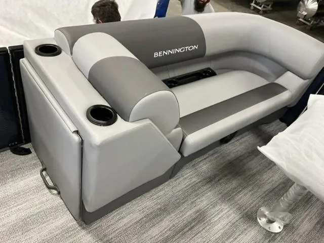 Slide: The Image of 2025 Bennington 22 SSR boat seating with gray upholstery and cup holders. - 15