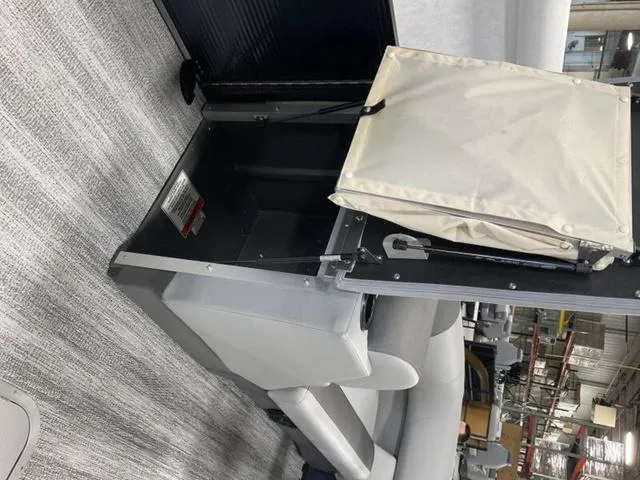 Slide: The Image of 2025 Bennington 22 SSR interior with modern seating and storage compartment. - 17