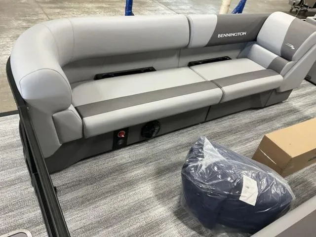 Slide: The Image of 2025 Bennington 22 SSR boat interior with gray seating and accessories. - 6