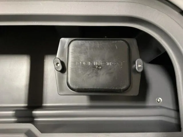 Slide: The Image of Bennington 22 SSR 2025 boat compartment with cover, showcasing durable design. - 7