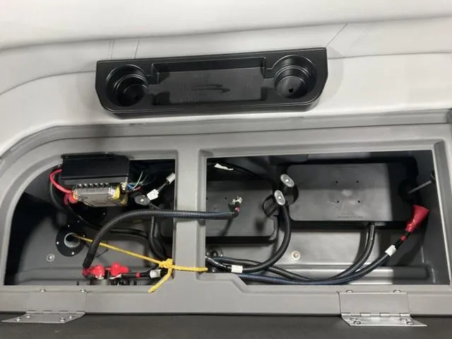 Slide: The Image of 2025 Bennington 22 SSR boat interior wiring and storage compartments. - 8