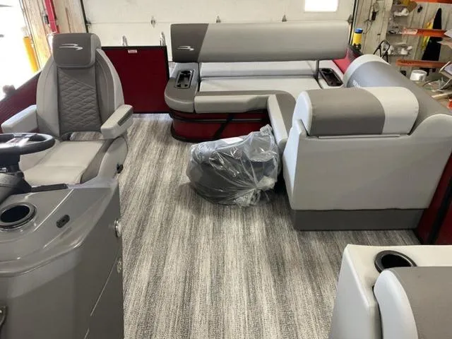 Slide: The Image of 2025 Bennington 23 SSB boat interior with gray seating and modern design. - 22
