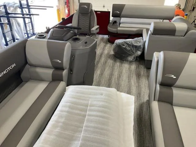 Slide: The Image of 2025 Bennington 23 SSB pontoon boat interior with gray seating and modern design. - 23