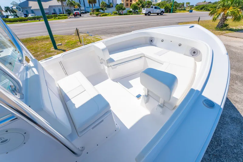 Slide: The Image of 2026 Albury Brothers 23 boat interior with white seating and open deck design. - 14
