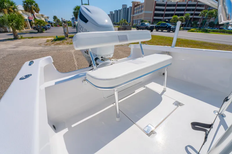 Slide: The Image of 2026 Albury Brothers 23 boat with Suzuki engine, featuring a sleek white interior. - 16