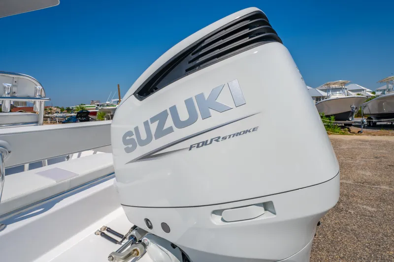 Slide: The Image of 2026 Albury Brothers 23 boat with Suzuki Four Stroke engine, outdoor display. - 25