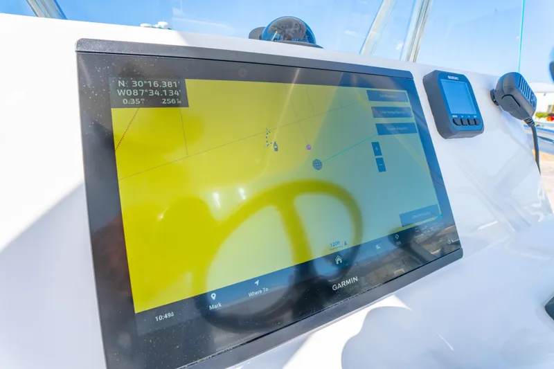 Slide: The Image of Garmin navigation display on 2026 Albury Brothers 23 boat dashboard. - 28