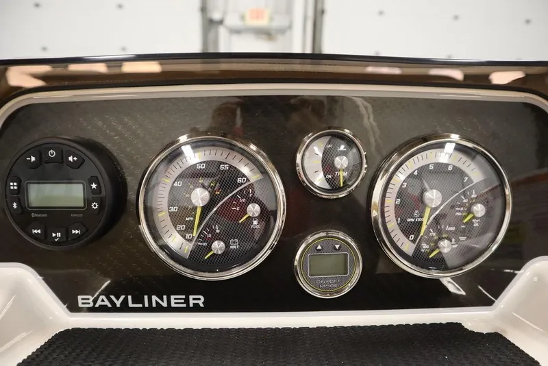 Slide: The Image of Dashboard of 2024 Bayliner DX2050 boat with gauges and controls. - 13