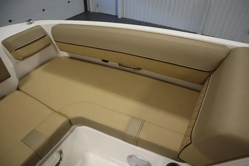 Slide: The Image of 2024 Bayliner DX2050 boat interior with beige seating and modern design. - 14