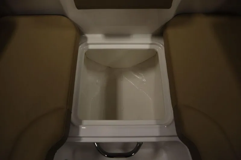 Slide: The Image of 2024 Bayliner DX2050 storage compartment with open lid, showcasing interior space. - 27