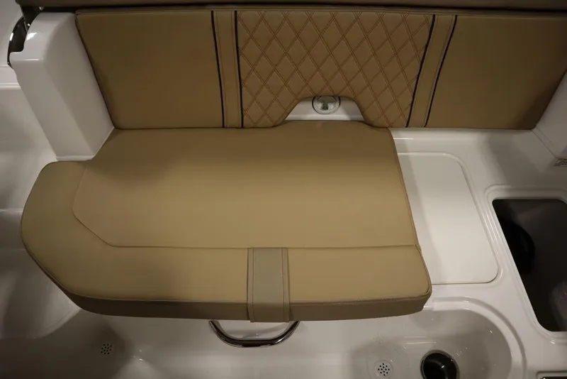 Slide: The Image of 2024 Bayliner DX2050 boat seat with tan upholstery and diamond stitching. - 30