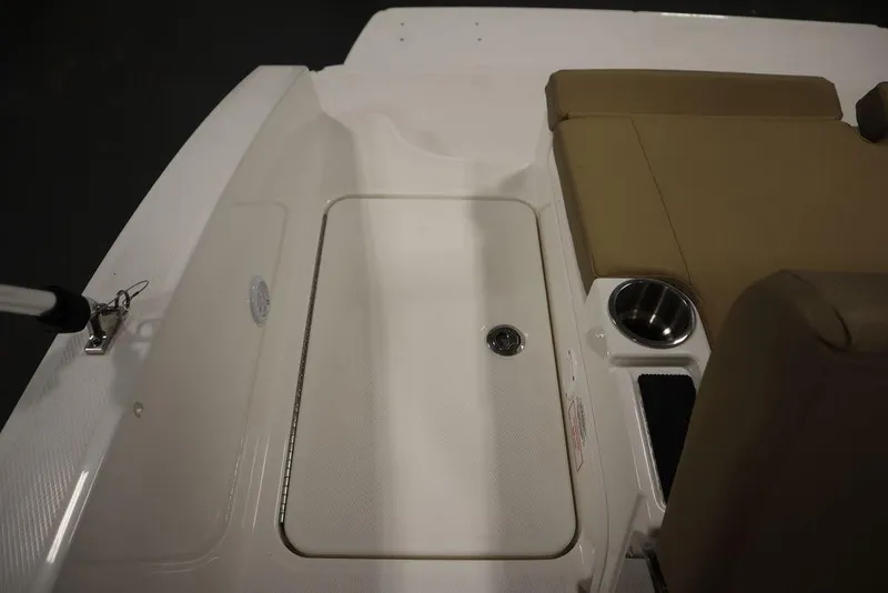 Slide: The Image of 2024 Bayliner DX2050 boat interior with seating and storage area. - 40