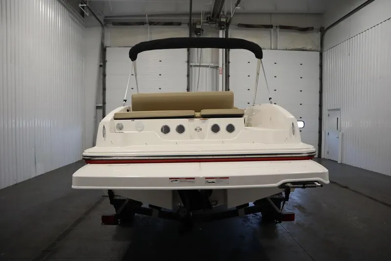 Slide: The Image of 2024 Bayliner DX2050 boat in indoor storage, rear view. - 5