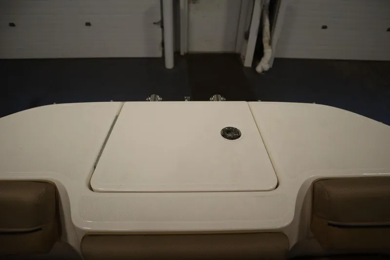 Slide: The Image of 2024 Bayliner DX2050 boat interior with storage compartment. - 6