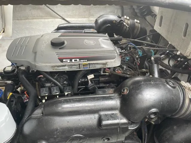 Slide: The Image of Engine of 2011 Bayliner 235 Bowrider, featuring 5.0 MPI MerCruiser. - 11