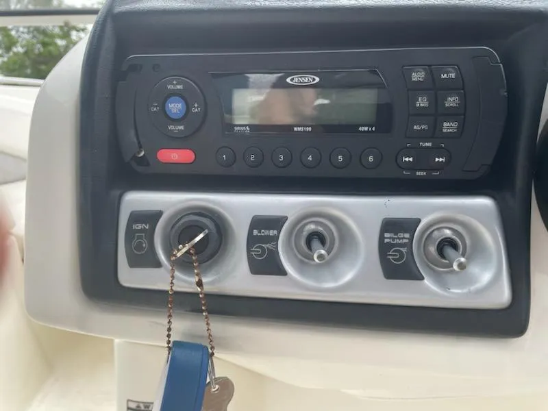Slide: The Image of Control panel of a 2011 Bayliner 235 Bowrider with ignition and switches. - 18